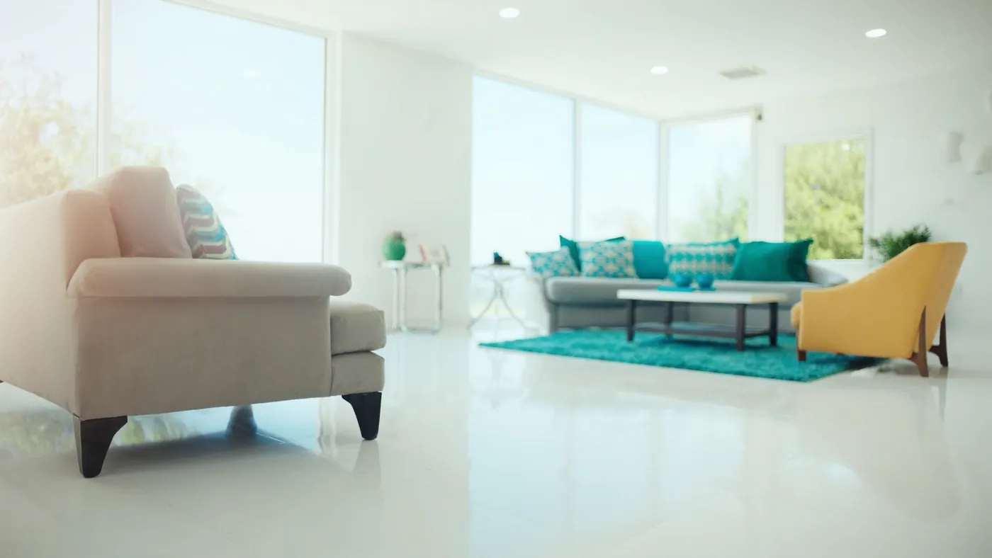 A spotless sunlit modern living room, gleaming and immaculate